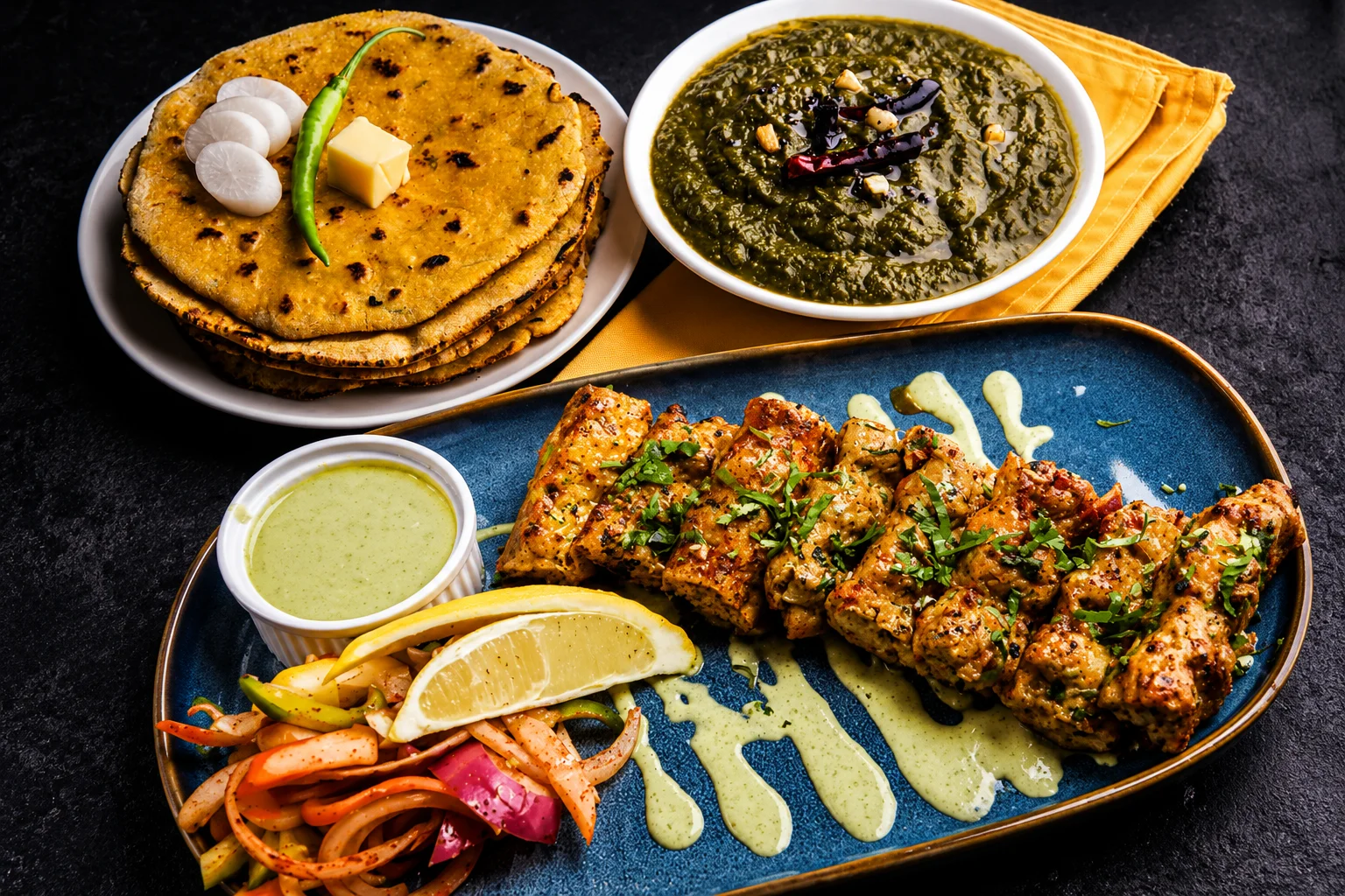 The Samosa Shop Indian catering spread in Edmonton featuring samosas, butter chicken, and traditional street food